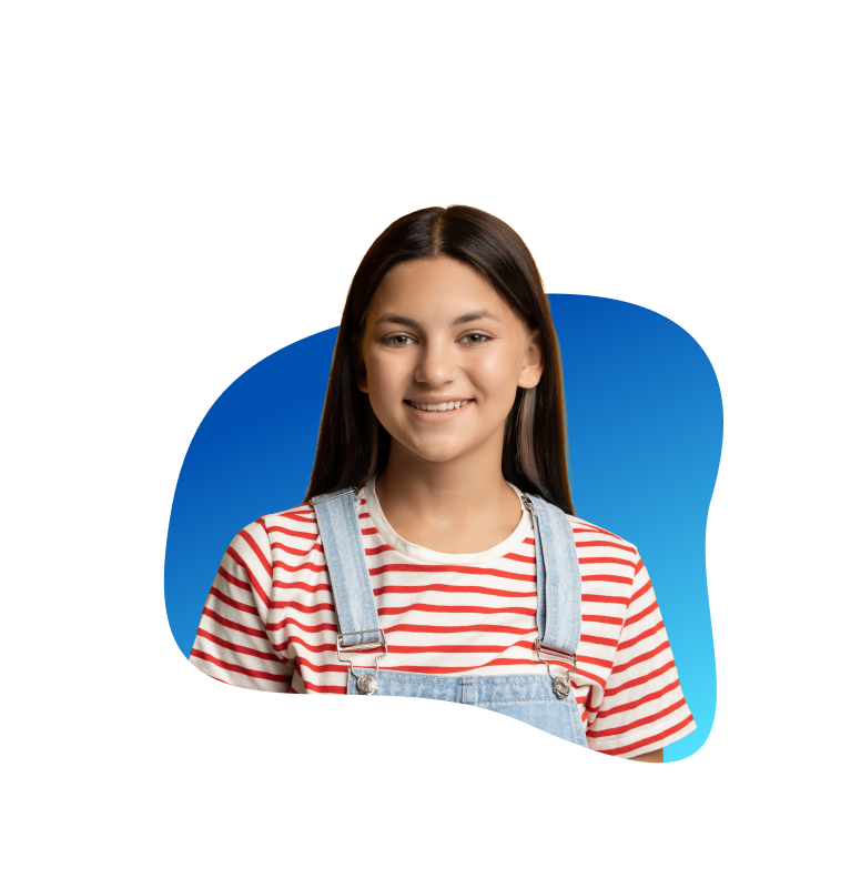 Adolescent girl smiling in front of a blue background