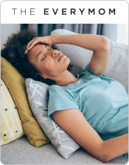 tired woman lying on couch with hand on head and eyes shut