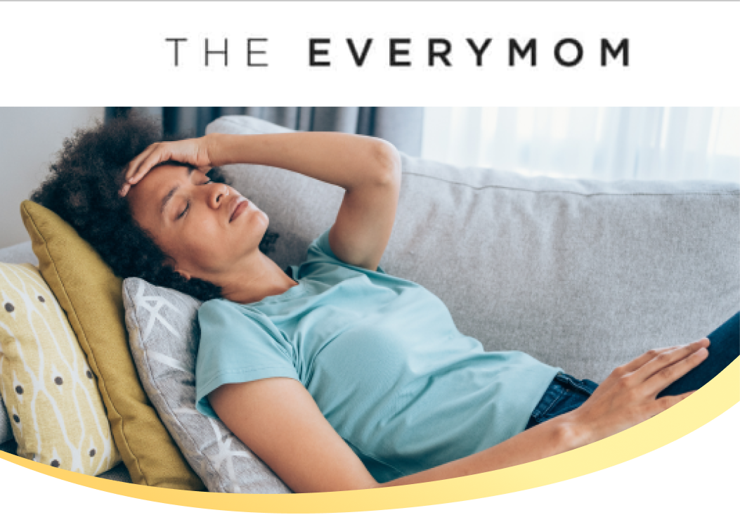 Woman lying on the couch with exhaustion below The Every Mom logo
